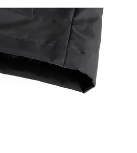 Detailed close-up of the straight hem and fine fabric texture on a black casual jacket