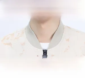 Detail of the ribbed baseball collar and marble print fabric on this trendy jacket
