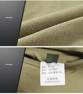 Detail of olive green vest showing thermal fleece lining and fabric wash care labels