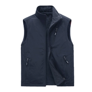 Men's reversible winter fleece vest with stand collar and zipper pockets in deep blue