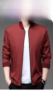 Close-up of burgundy zipper jacket with ribbed cuffs and vertical collar detail
