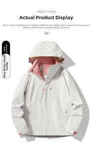 Detail of warm white outdoor jacket with coral pink lining and hood adjustment features