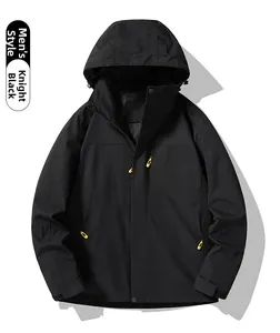 Detail of knight black windproof outdoor jacket featuring a yellow zipper pull cord