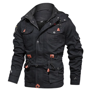 Detail view of black winter hooded jacket with heavy zippers and four large cargo pockets