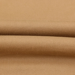 Macro view of camel twill fabric texture for winter hooded jacket with thick lining