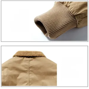 Detail of windproof ribbed cuffs and warm sherpa fleece collar on khaki work jacket