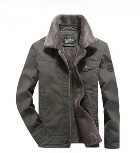 Detail view of army green winter jacket with plush faux shearling lining and chest patches