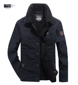 Detail of navy blue fleece-lined men's winter jacket with wool collar and mountain patch