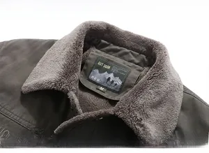 Close-up of winter jacket collar featuring warm grey fleece lining and M size label