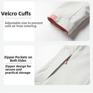 Detail of adjustable velcro cuffs and concealed zipper pocket on a light grey jacket