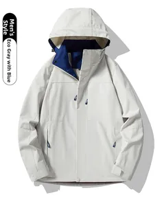 Detail of waterproof hooded outdoor jacket in eco-grey with contrast royal blue lining