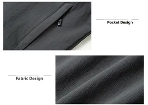 Detailansicht der Reißverschlusstasche und des strukturierten Stoffes der grauen Jacke