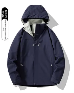 Detail view of navy blue outdoor windbreaker jacket with gray lining and zip pockets