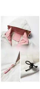 Detail view of white outdoor jacket with pink mesh lining and adjustable drawstring hood
