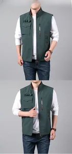 Detail of pea green outdoor utility vest showing multi-pocket design and orange lining