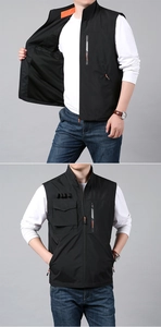 Detail of black outdoor vest featuring multi-pocket design and standing collar with orange lining