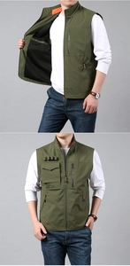 Detail of military green tactical vest with multi-zipper pockets and contrast lining
