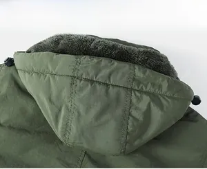 Detailed close-up of army green men's winter jacket with windproof hood and grey plush lining