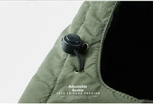 Close-up of military green winter jacket with adjustable elastic drawstring toggle