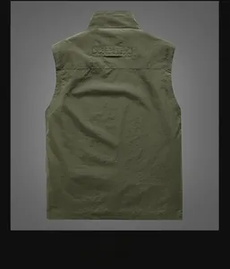 Rear view of green utility vest featuring a classic leather patch and stand collar detail