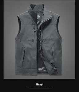 Detailed view of dark gray outdoor vest featuring mesh lining and multiple functional pockets