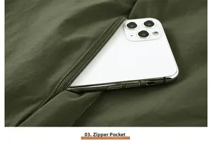 Close-up of the large zippered pocket on this olive green outdoor functional fishing vest
