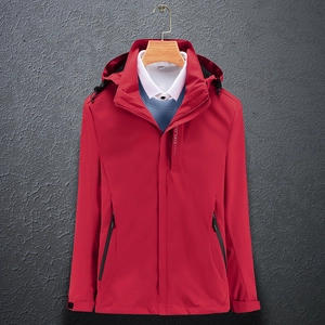 Detail of red waterproof jacket with EXPLORE zipper and adjustable velcro cuffs
