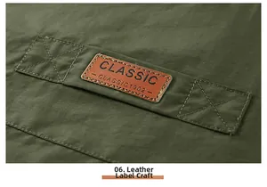Detail showing the classic leather label craftsmanship on army green cargo vest fabric