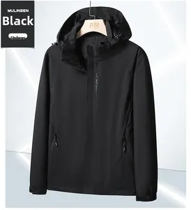 Detail of a black hooded outdoor jacket featuring white EXPLORE text on the chest