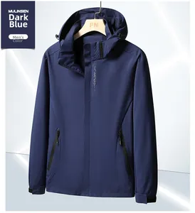 Detail of navy blue waterproof hiking jacket with EXPLORE logo and adjustable cuffs
