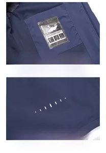 Detail view of hidden inner pocket and windproof hem on navy blue hiking jacket