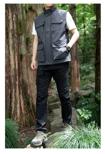 Close-up of tactical multi-pocket vest with D-ring detail for outdoor hiking and fishing