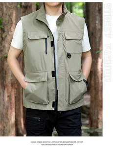 Detail of outdoor multi-pocket cargo vest with functional zippers and durable d-rings