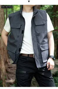 Detail of dark grey outdoor multi-pocket fishing vest with D-ring and zipper on model