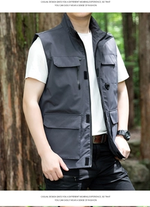 Detail of multi-pocket outdoor tactical vest in charcoal grey with stand collar
