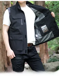Detailed interior of a tactical black vest showing the zipper pocket and patterned lining