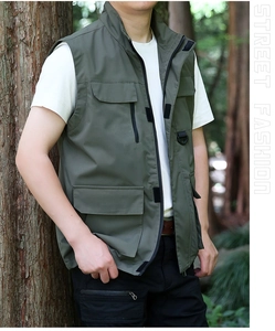 Detail view of the durable army green tactical vest with multiple utility pockets