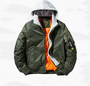 Detail of army green MA-1 flight jacket showing orange lining and removable grey hood