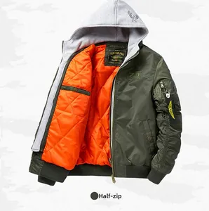 Detail of army green bomber jacket featuring signature orange diamond quilted lining