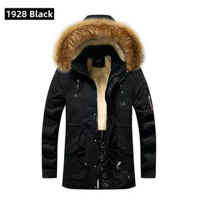 Detail of black winter parka for men with warm beige fleece lining and faux fur hood