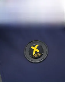 Detail view of cotton jacket with embroidered fashion superstarboy circular patch logo