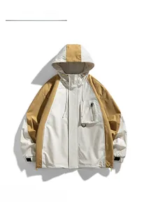 Detail of hooded color-block outdoor jacket with functional zipper chest pocket and beige trim