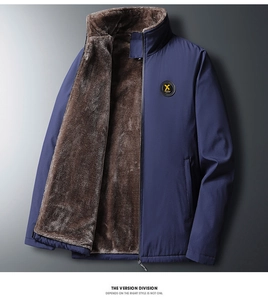 Detail of winter jacket with warm brown faux fur lining and windproof navy blue shell