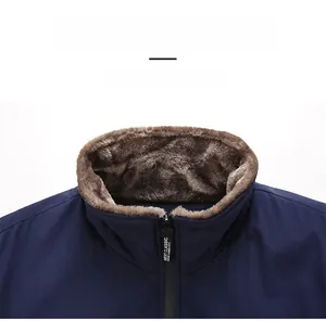 Detail of dark blue winter jacket featuring a plush brown faux fur collar and zip closure