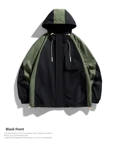 Detail view of hooded jacket with olive and black contrast panels and zip pocket