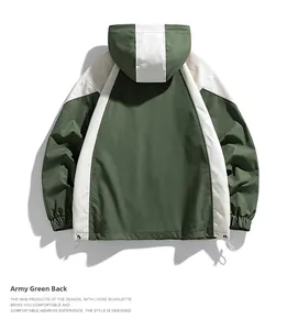 Detail view of the green outdoor jacket back with contrast panels and adjustable drawstring