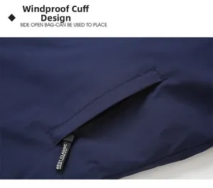 Detail view of winter jacket featuring windproof pocket with decorative zipper puller