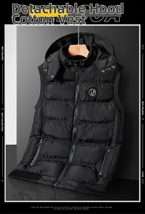 Detail view of black quilted vest for men featuring a detachable hood and round zip pullers
