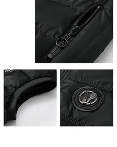 Detail view of black quilted vest featuring metal zipper pocket and ribbed cuff details