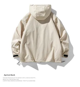 Back view of apricot loose hooded jacket with adjustable velcro cuffs and drawstring hem